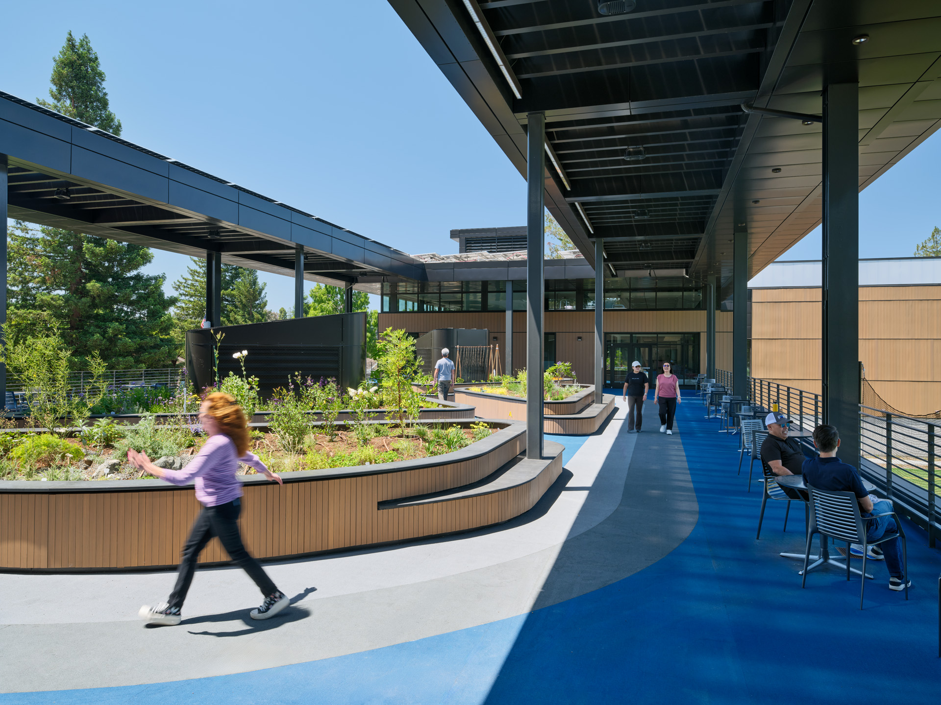 Rooftop terrace with INNOWOOD® screening planters and outdoor gathering space