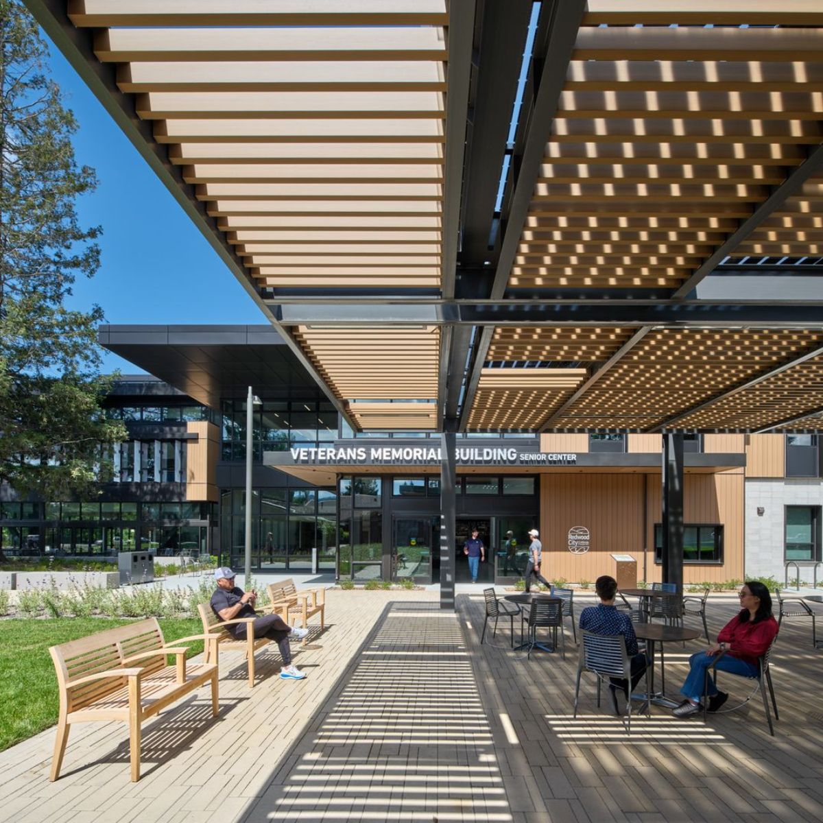 Veterans Memorial Building entrance with pergola screening